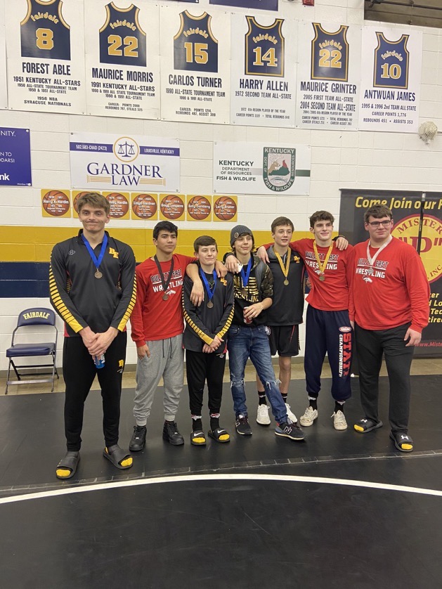 The wrestlers pose after the region three tournament. The team is sending seven wrestlers to state this coming weekend. Im just going to go out and wrestle my best and Im sure thatll be good enough to bring home our first state placer, said junior Matthew Hendricks. 