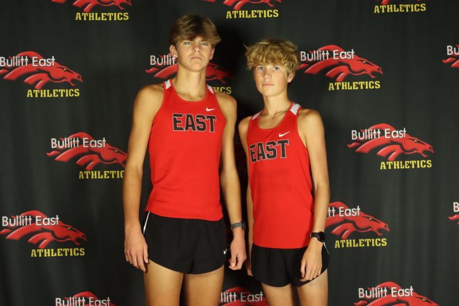 Some runners on the track team pose ahead of the season.