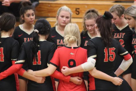 Bullitt East in a huddle as they play against Whitefield. They won 3-1 after losing the first set and were 24 District Runner-Ups. Having Whitefield as the first round of districts had us a little nervous at first going in because we had gone five with them in the middle of the season but as soon as the game started I think we all knew we had it. We set a goal for ourselves after losing the first game that we would beat them out the next three and we did that, senior Mckenna Humphrey said.