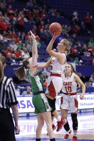 Lilly Reid leaps into the air for a layup. On March 11 the lady chargers played at Rupp Arena in the KHSAA state tournament against Meade County. Its every high school players dream to get to the state tournament, Reid said. 