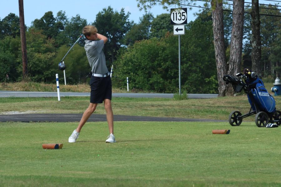 Freshman Aidan Boyer tees off on the par four number one at Elizabethtown Country Club.