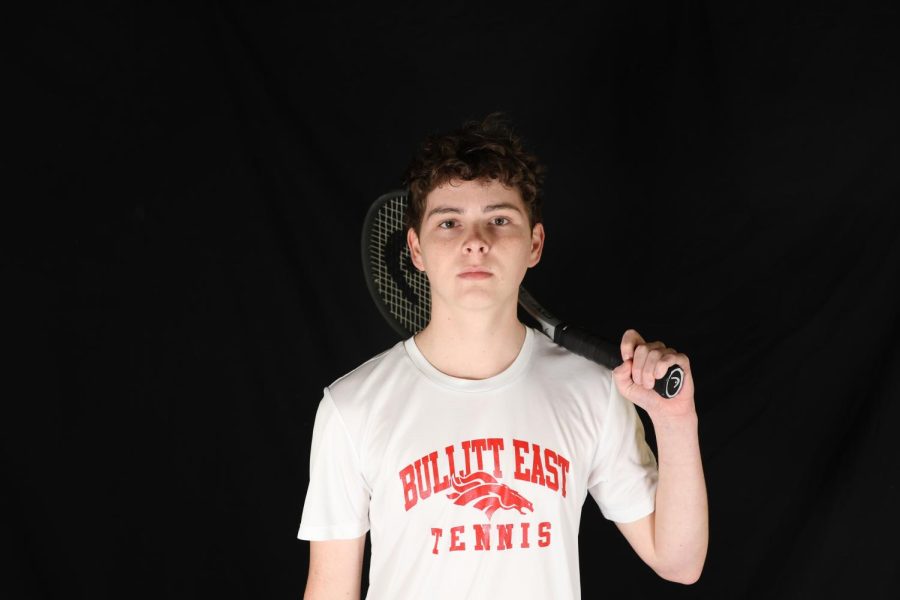 Senior Will Brangers poses with his racket. The boys tennis team season has started this month. For all of us just playing consistent. Last year we had some issues with that and we’re all determined to fix that,” Brangers said. 