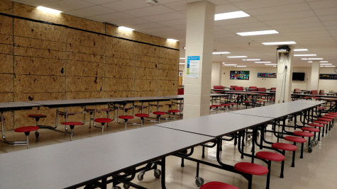 The new wall in the cafeteria has caused some big adjustments for tables and students.