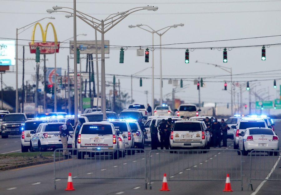 Baton Rouge police surround the scene of the shooting. 