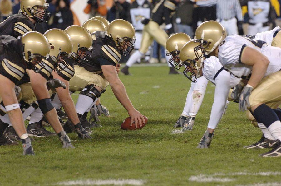 Army (left) and Navy (right) facing off against each other in their annual rivalry football game.