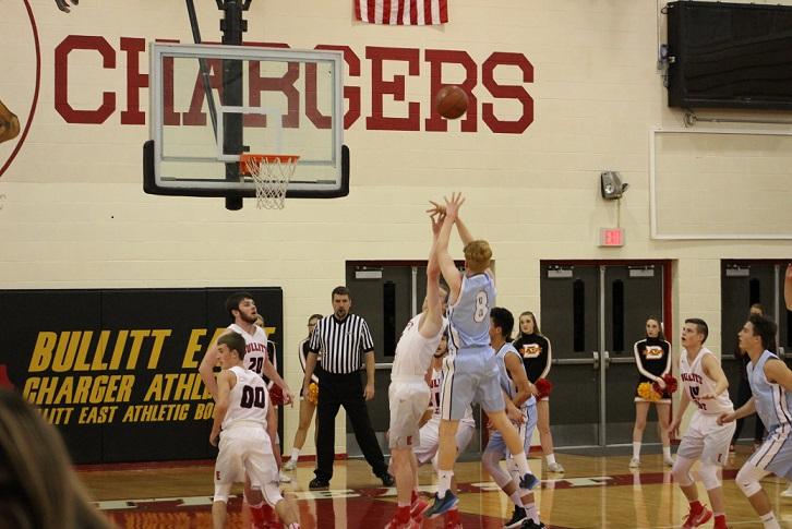 Kings School point guard Ben McLeod shoots over the Charger defender as he tried to bring his team back from a large halftime deficit. 