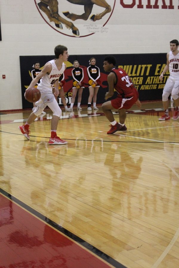 Point guard Luke Ezell brings it back out to set up the offense for the Chargers. 