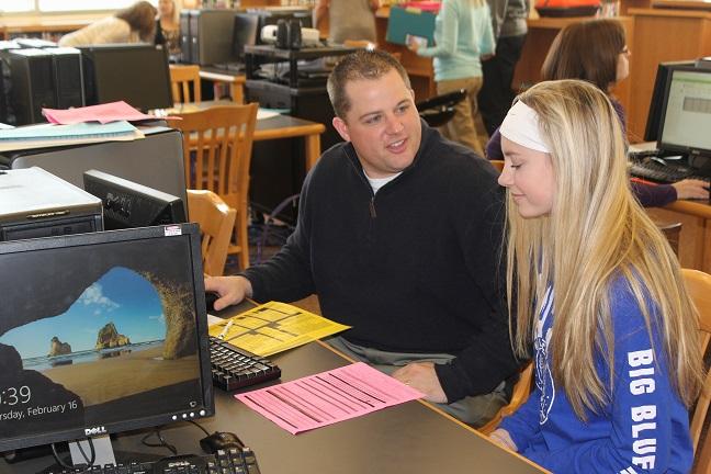 Freshman Carissa Kimball schedules her classes with Mr. Rock.