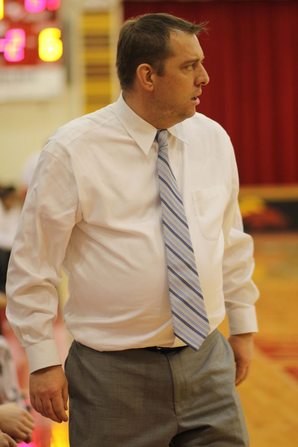 Head Coach Jason Couch patrols the sidelines during an intense district game against J-Town.