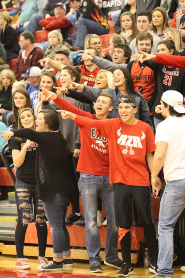 RedZone+leaders+start+a+cheer+at+a+boys+basketball+game.