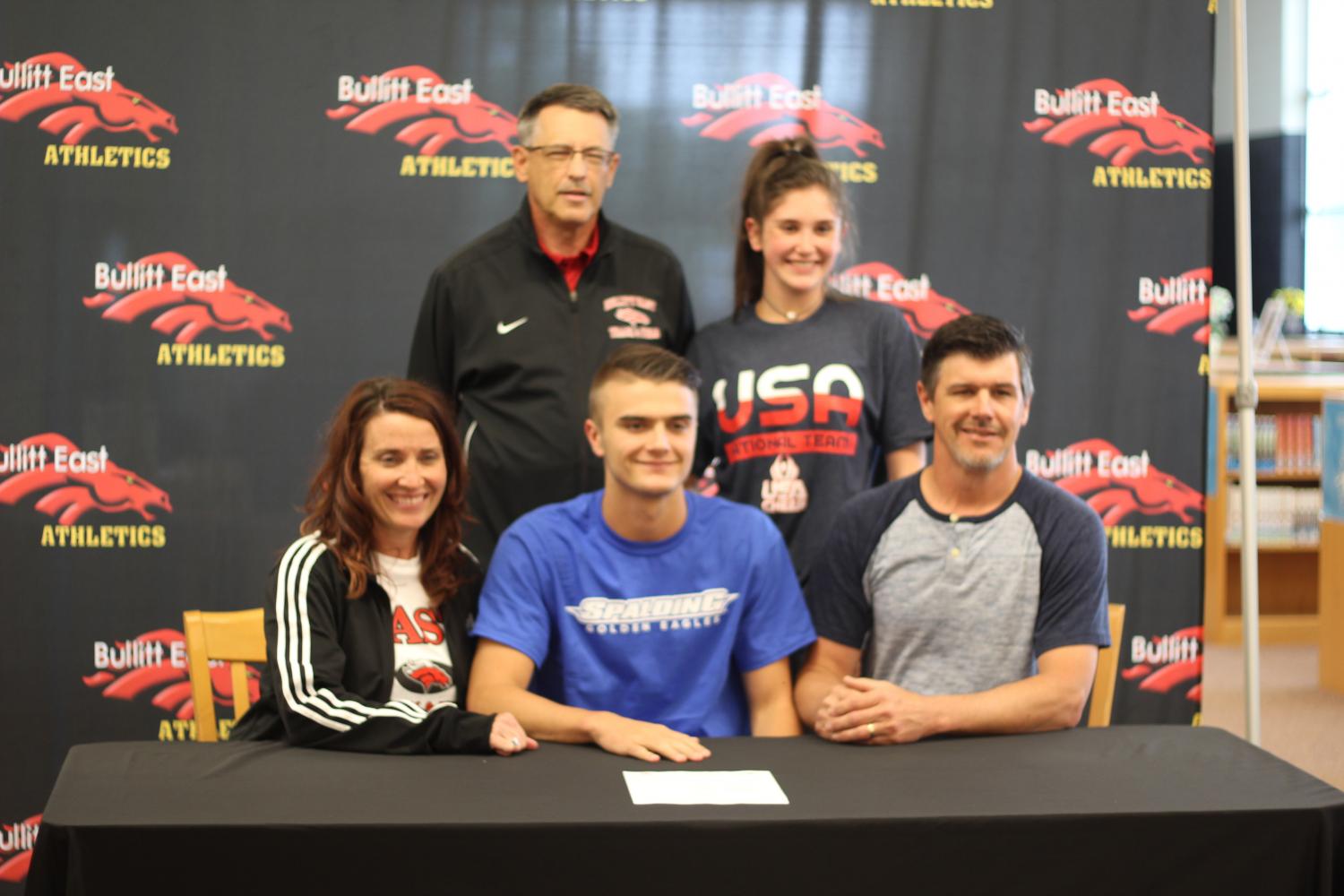 On May 1, Senior Connor Green signs with Spalding University to run track. Along with him is his family and his track and field coach, Lenny Raley.