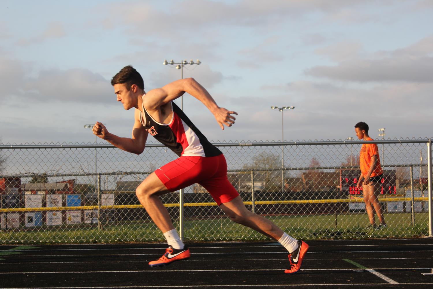 Senior Connor Green running in the boys 400 meter dash at Bullitt East.
Photo: Haley Grether