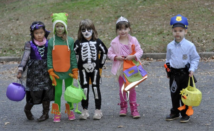 Kids from all around go door to door to get candy. 