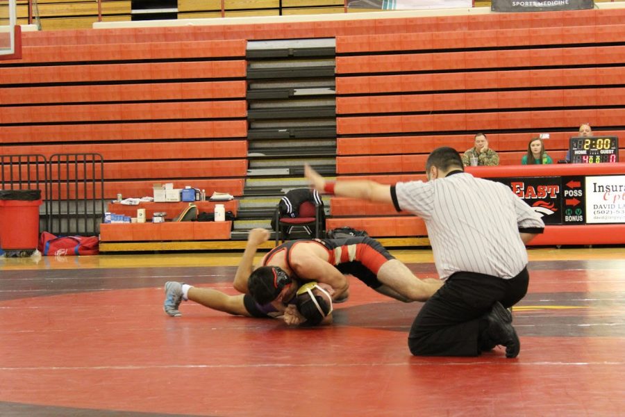 East wrestler takes down Bardstown wrestler.