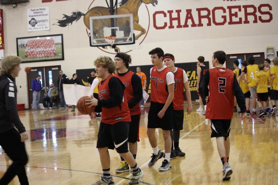 Sophomore participants warming up before the game. The sophomores were only able to win one of two games they played. "The scrimmages are to get you excited about the game that is happening tonight so that you will go and support your school," said junior Matthew Brown. 