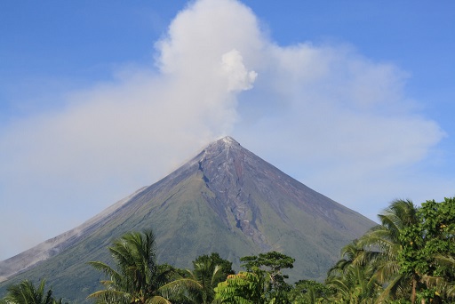 Ash shoots out of Mount Mayon Volcano as it began erupting.