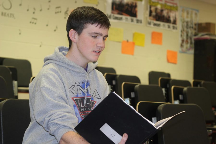 Senior+Joey+Byrd+prepares+for+KMEA+All-State+by+reviewing+music+in+class.