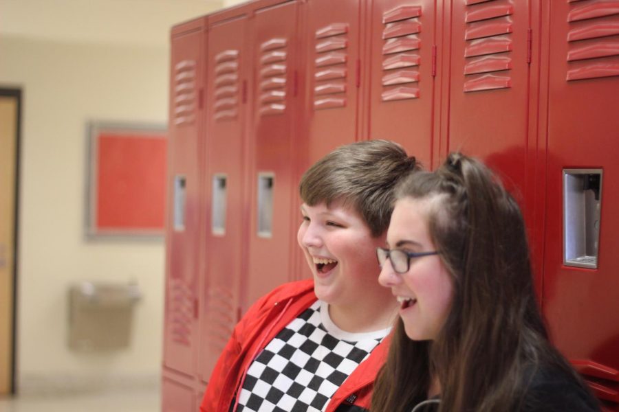 Choir+members+Burgundy+Maloney+and+Jonah+Brown+practice+singing+together.