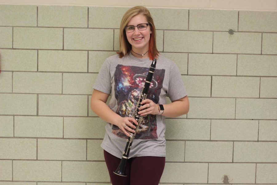 Wind ensemble member Patience Robinson poses with her clarinet.