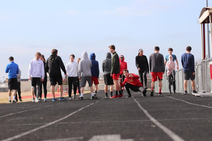 Members of the team at practice warming up before a run. 