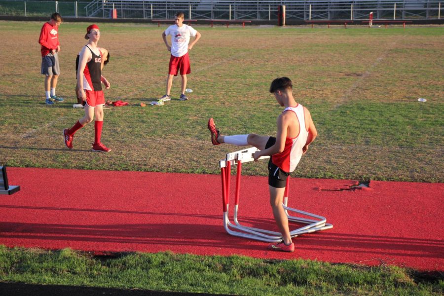 Freshman Camden Bohannon stretching before a run.