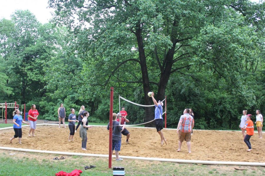 Attendees make use of the Bardstown Community Parks volleyball court during the annual choir picnic.