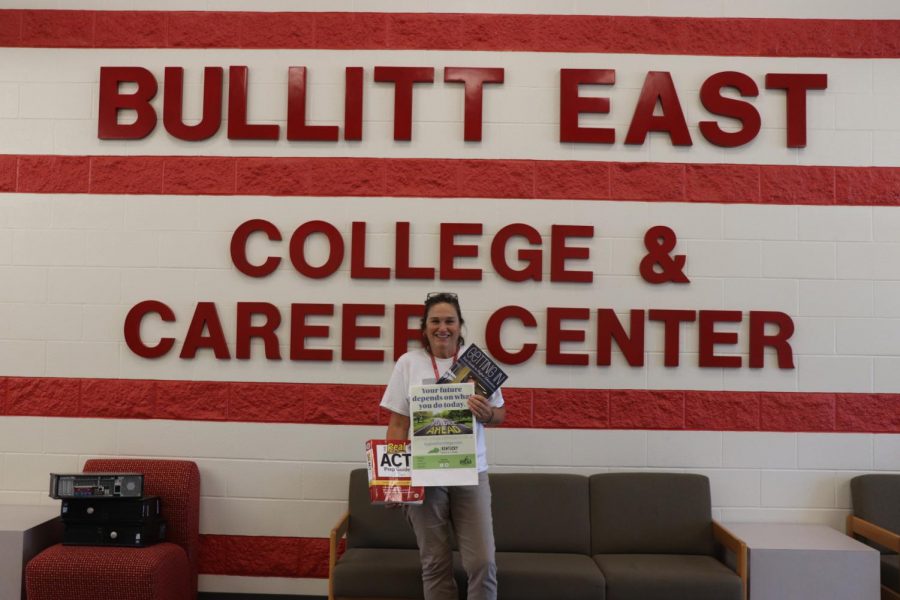 Here is Wendy McCutcheon, College and Career Readiness Director at Bullitt East, holding three helpful sources for students to become college- or career-ready or to explore their options regarding their college or career. This program aims to help students prepare for transitioning into whichever postsecondary education or career they choose, withstanding the new changes that have been made in Kentucky for the college and career readiness criteria. It used to be called college- and career-ready. Now it is academic transition-ready or career transition-ready. Transition meaning that they (the students) have fulfilled or they have demonstrated performance and knowledge that they will be able to transition, either into the workforce or into a postsecondary education, said McCutcheon.