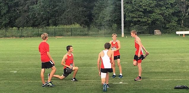 The boys on team warm up for their meet.