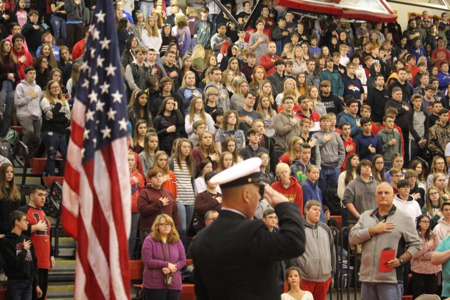 Master Sergeant Chief Charles Ballard sharing his speech about his own and others experiences serving in the military as students listen attentively. The speech was intended to be one of the ways that Vice Principals Cyndi Bell and Tim Ridley could emphasize the importatance of veterans during the assembly. I visited the Philippines, Hong Kong, Korea, Japan and Hawaii all within my first eight months in the Navy at 18 years old, said Ballard.