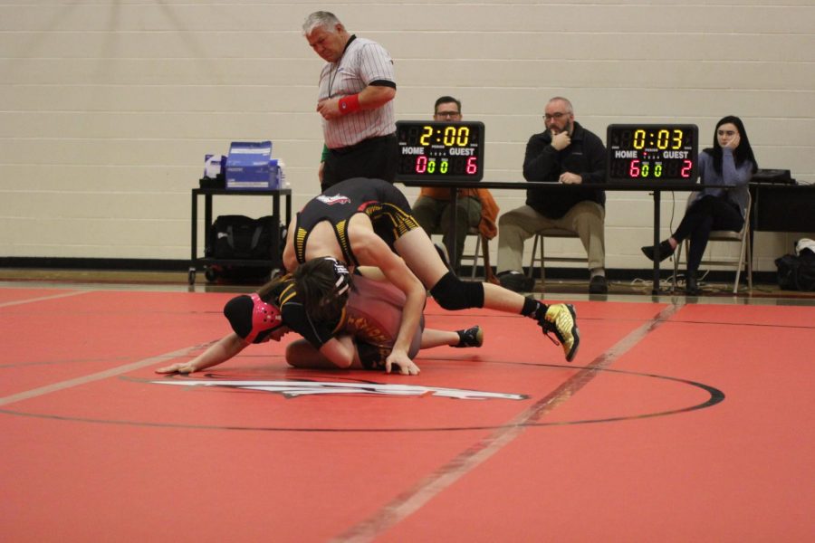 Sophomore Matthew Hendricks, a member of the wrestling team, beats Taylor County High School as the second competitor during the home match on Jan. 9. Contributions like his and other members of the team who have been putting forth a relentless effort to strengthen their wrestling skills are the main sources of the team's improvement from last year; if the effort continues, the team will be much more likely to finally achieve the end-of-season goals that have been desired by them for many years. "Wrestling is more than a sport, it's a brotherhood," said Hendricks.