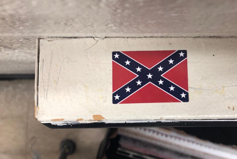 This+is+a+Confederate+flag+sticker+on+the+top+of+an+outlet+in+a+classroom+in+second+hall.+The+stickers+have+also+been+found+in+other+classrooms+in+different+locations.+