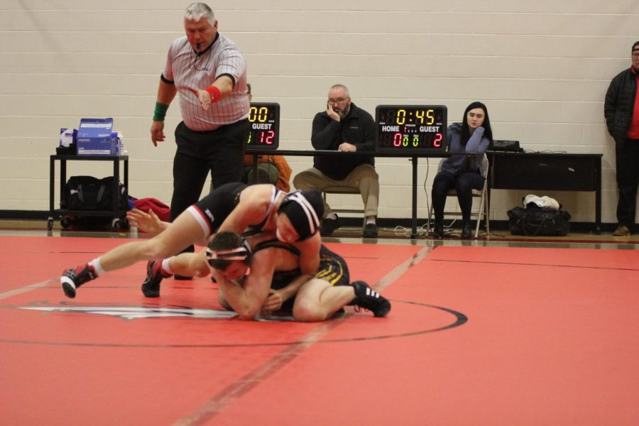 One of the members of the wrestling team competes against a wrestler from Taylor County High School at a home match on Jan. 9. Although Bullitt East did not win the competition, each members participation further prepared them for the Regions and State tournaments in February, in which they are working towards becoming a champion in, by allowing them to realize their weaknesses and improve upon those during the remainder of the season. After each competition, we point out what the wrestlers do well and what mistakes each wrestler has to correct and work on, said the wrestling coach, Tom Wells.