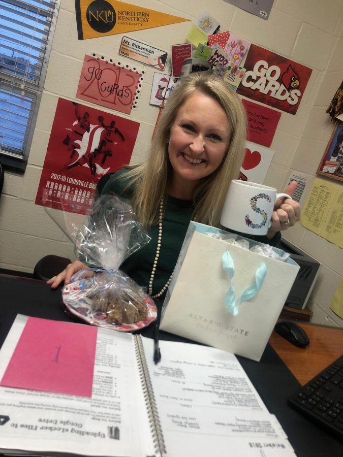 Guidance Counselor Savannah Richardson poses with gifts from students.