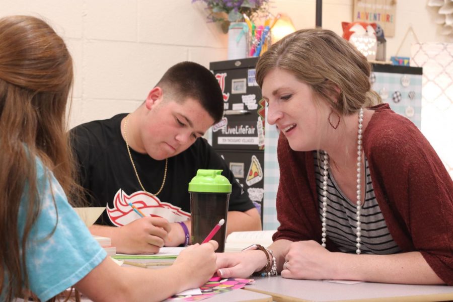 Working with a student, Phillips discusses things they learned within the book they are reading in class, Fahrenheit 451. This is the first year Phillips is teaching sophomore English. 