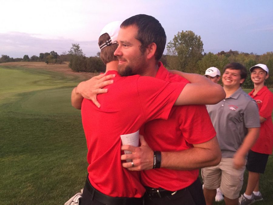 Coach+Kyle+Downs+and+Senior+Aiden+Robison+hugging.+Robison%2C+the+team%2C+and+Downs+all+got+emotional+after+Robison%E2%80%99s+last+match+ever%2C+and+Downs+decided+to+comfort+Robison+by+hugging+him.+%E2%80%9CI+met+Downs+in+fifth+grade%2C+and+I%E2%80%99ve+known+him+for+a+very+long+time%2C%E2%80%9D+said+Robison%2C+%E2%80%9CI+would+not+be+the+person+I+am%2C+if+I+was+not+on+this+team%2C+and+Downs+had+a+big+help+in+making+me+the+person+I+am+today.%E2%80%9D