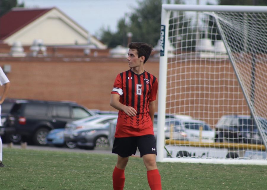 Senior Evan Wright walking on the field waiting to make his next move.