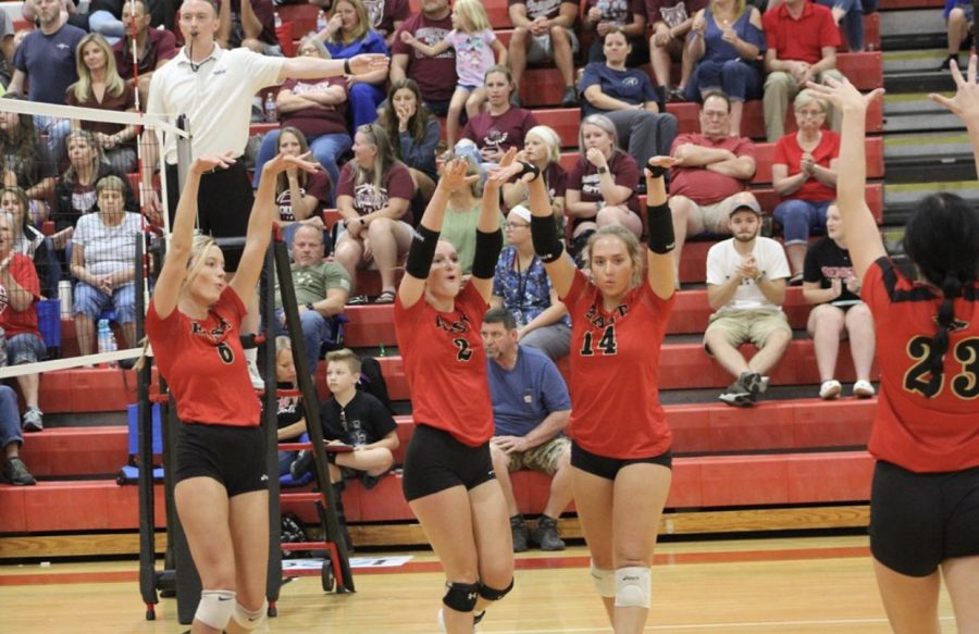 From left to right: Senior Carissa Kimball, senior Julia Kromenacker, junior Emily Popplewell, senior Halle Key. The team celebrates after having a good hit. Popplewell said, It feels good to have only lost one game so far. The team we lost to was really really good, and we could have beat them, but it just didnt happen that day.