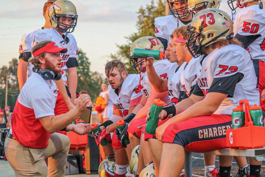 Coach Keegan Kendrick is giving the offensive line a talking to. The Chargers line made holes for the team to gain 221 rushing yards. 