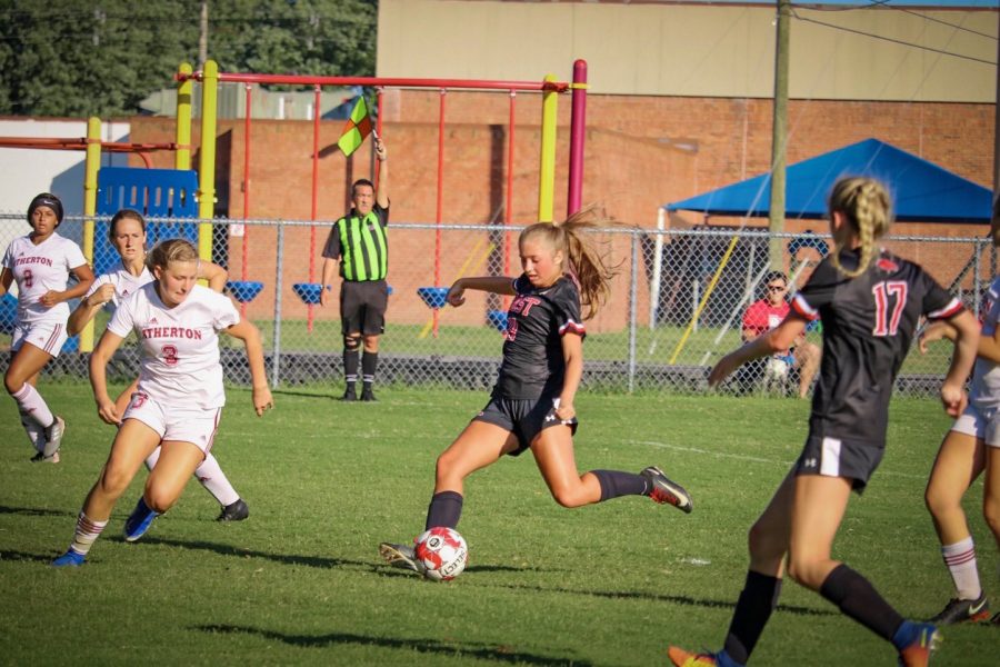 Charging in to kick the ball, senior Chloe Holt scores the first goal. The Lady Chargers played against Atherton with the final score being 4-0. 2. “It felt good scoring the first goal because once you get the first goal then it makes the whole team play harder,” said Holt.