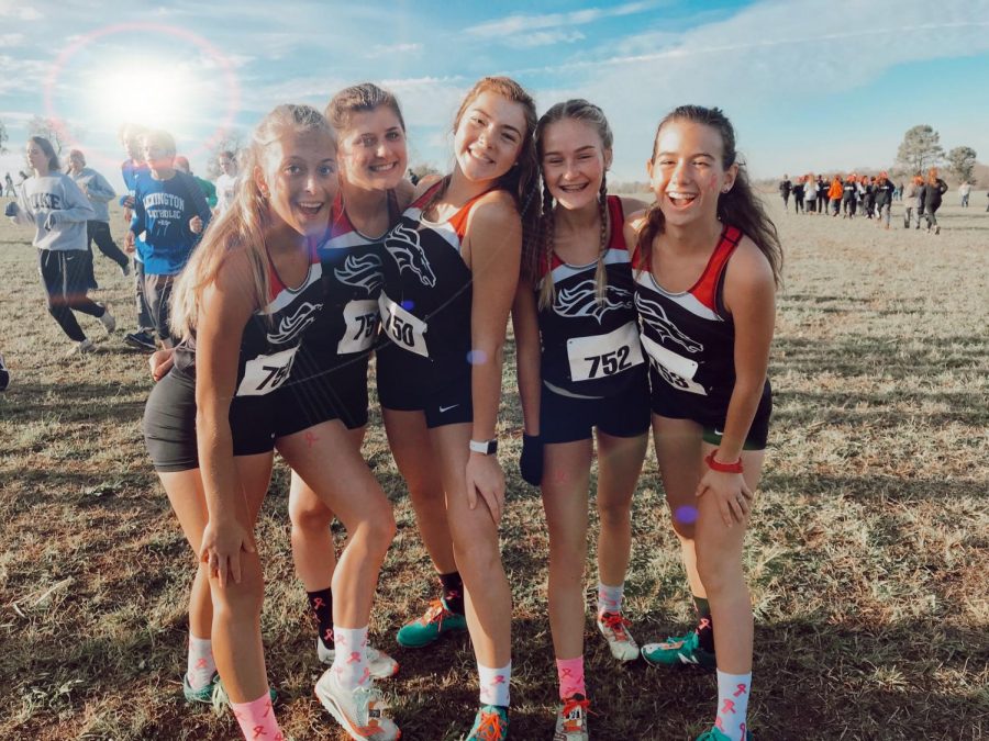 The cross country girls pose after a successful meet. Four of the girls finished in the top 35 in Saturday's race.