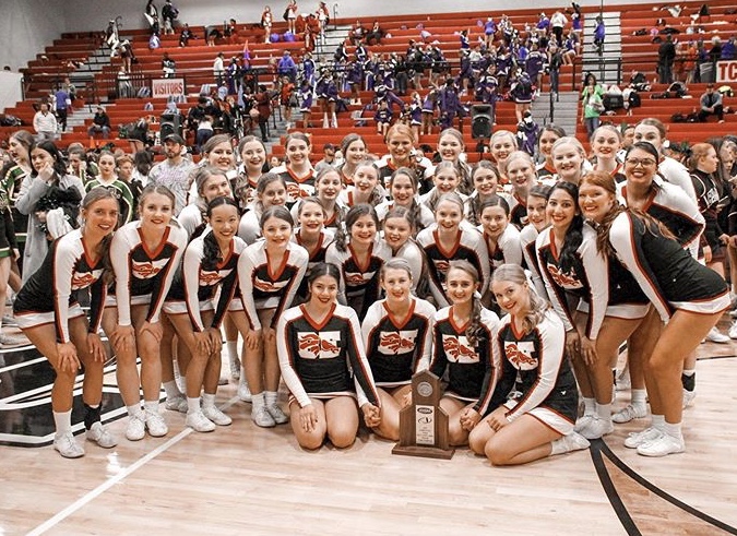 The+team+poses+with+their+trophy+after+winning+the+super+varsity+KHSAA+regional.+They+are+competing+in+the+state+competition+Dec.+14.+