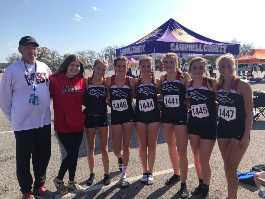 The girl cross country team take their last picture in uniform for the 2019 season. Every runner will be returning next year and the team looks to build on their experience as a team to succeed. 