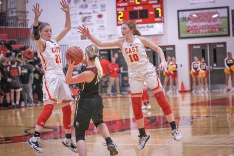 Attempting to block the pass, senior Caroline Scott and sophomore Emma Egan jump up to try to take possession of the ball. Despite the Lady Chargers blowing out the Lady Cougars, the girls are always looking for ways to improve their offense and defense.These components will help us advance past the upcoming pressure against our rivals, Butler and Mercy, said Egan.