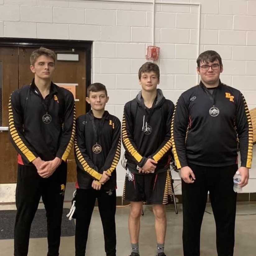 The boys wrestlers pose after the Gladiator tournament. They brought home three second place finishes.