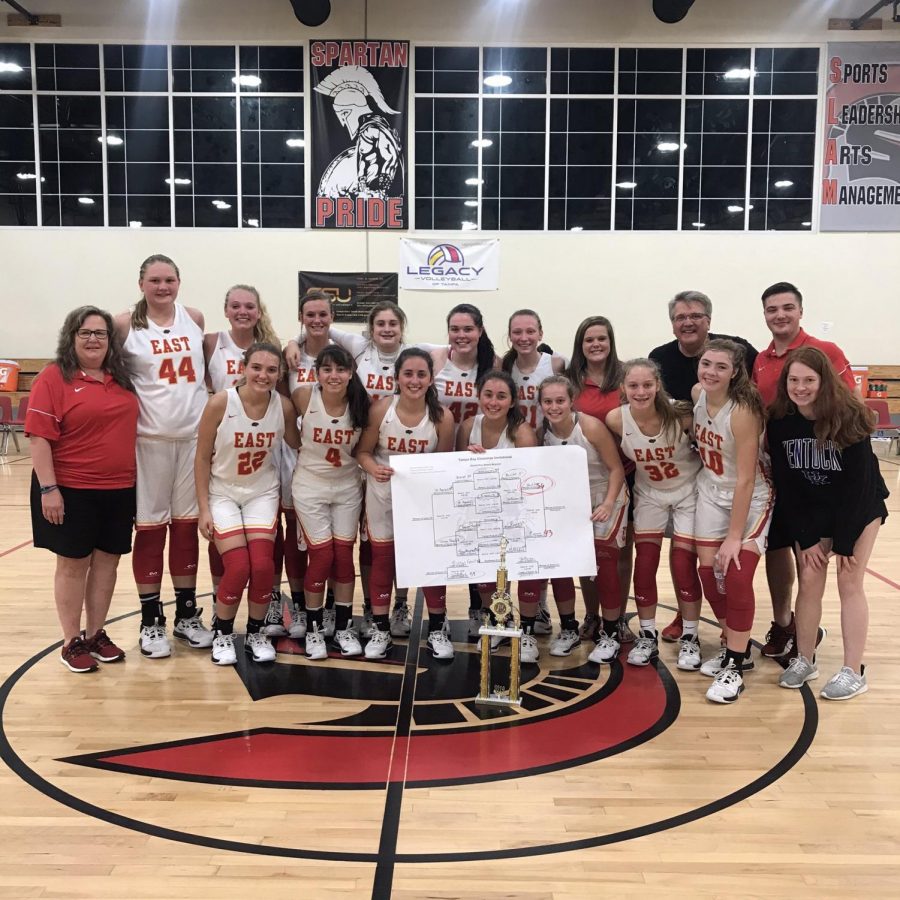 The Lady Chargers pose next to their trophy after being titled the champions of the Tampa Bay Christmas Invitational. The girls played a total of three games, winning all three of them. The win did give us the confidence, but just the fact of going down there and having team bonding, our team grew closer together which overall has a positive impact on our game play, said Sarah Ezell.