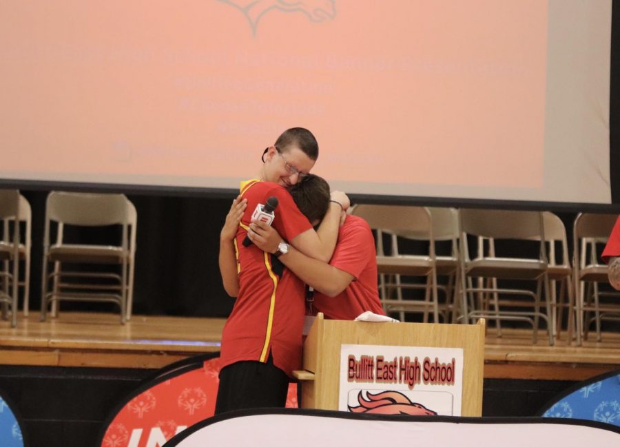 Senior Adam Moore and junior David Boyer hug after Moore's emotional speech about inclusion.
