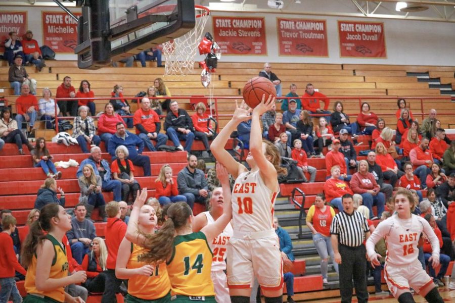 Getting ready to shoot a basket, sophomore Emma Egan scores another goal during their blow out against North Bullitt. However, it is not new for the Lady Chargers to blow out the opposing team. "It felt mostly average. We expected to beat them and anything else would have been highly disappointing," said Egan.