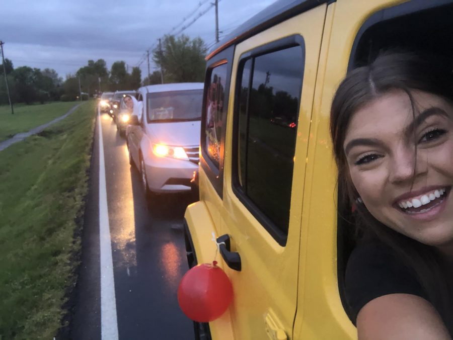 Senior Meredith Bass, taking a selfie, in her car, at BE the Light. Apr. 23, 2020, an event was held where seniors, and their families, could go to Bullitt East, and drive around their high school one last time, and Bass went there. “I was completely not expecting to be so emotional until the music came on, it added to everything and the teacher messages were amazing. It was really hard to see the baseball team so upset about their pregame song and jerseys hung up. I don’t think it had really sunk in that i was going to be saying goodbye to BE, so when it hit it was really hard. It wasn’t the send off we expected but our faculty and administrators really went above and beyond to make it special and I am so thankful for that,” said Bass, “I would drive through it 1000 times. I love Bullitt East, and it was filled with everything I love about it.”