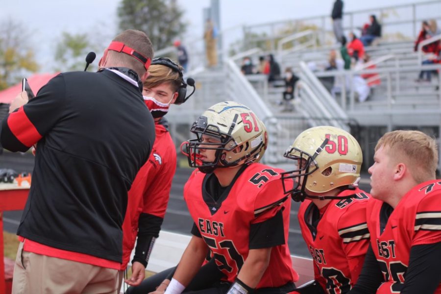 Coach talking to players about plan. Oct. 24, Bullitt East lost to Male, with a score of 49-0. “Male is a really good team, and we did not play up to our ability. When you combine those things, the game can get out of hand very quickly. We made some mistakes early, and Male took advantage of them. You cant give a team like Male any extra help,” Receivers Coach Tyler Faucett said, “We need to continue to improve. We still have two regular season games, and the playoffs left. We need to get better in every aspect of our team.”