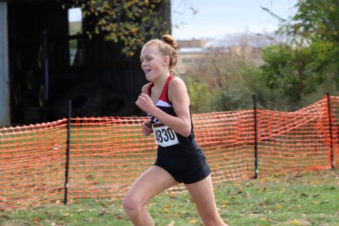 Seventh grader Alex Egan gives it her all as she nears the end of the race. She finished in second place.